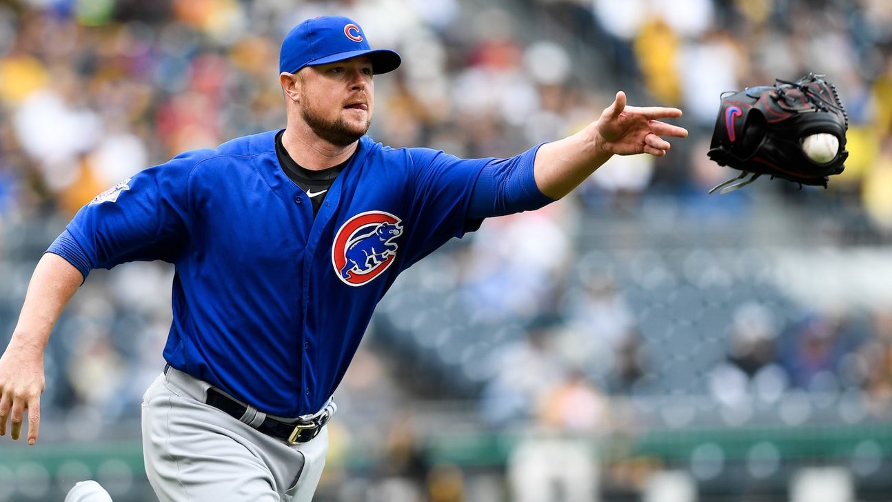 Cubs pitcher Jon Lester is still throwing his entire glove to first base