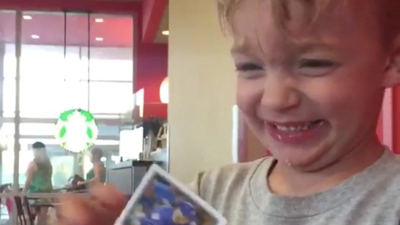 Little Cubs fan is brought to tears by the joy of getting a Kris Bryant baseball card