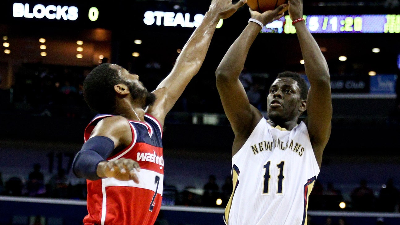 Pelicans' Holiday reaches 5,000 point milestone