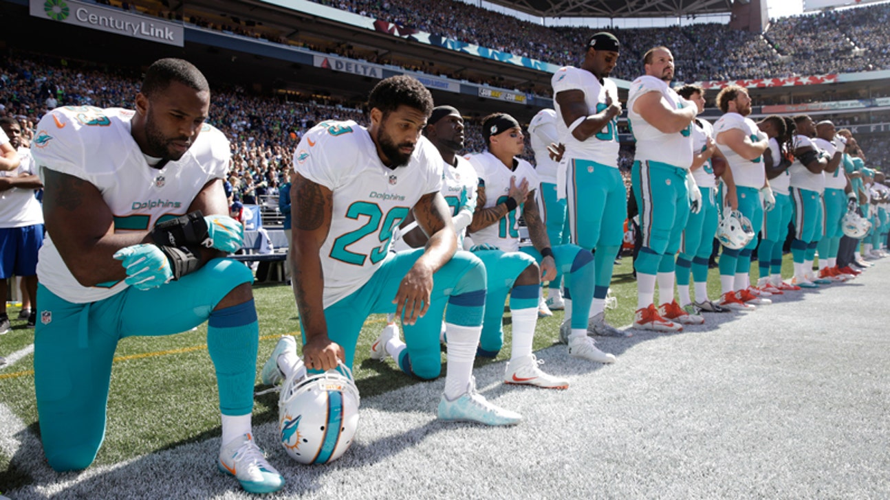 Four Dolphins players kneel during 'The Star Spangled Banner'