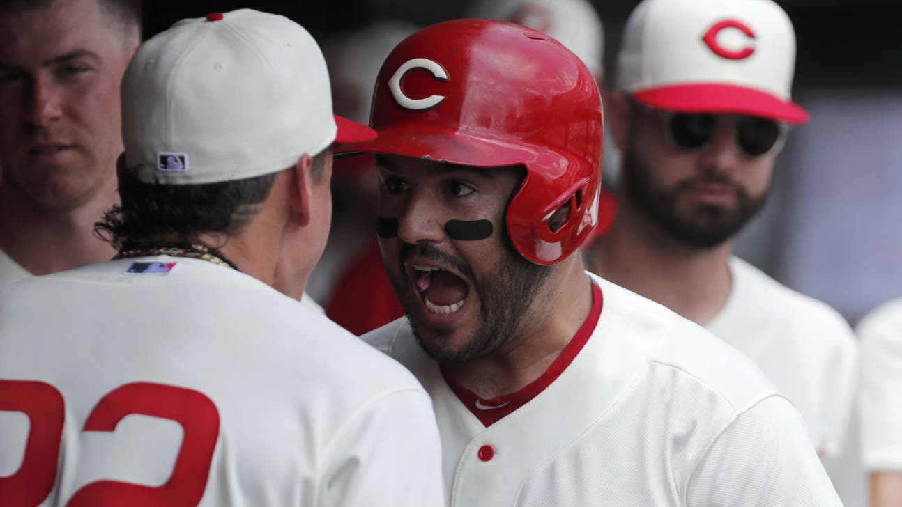 Suarez homers early, Reds hold on for 8-6 victory to win third straight series over Cubs