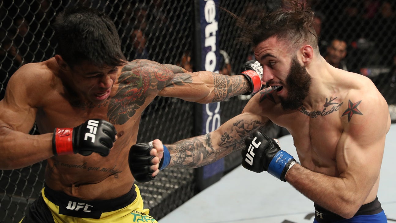 UFC fighter Shane Burgos forced to get haircut in middle of fight (Video)