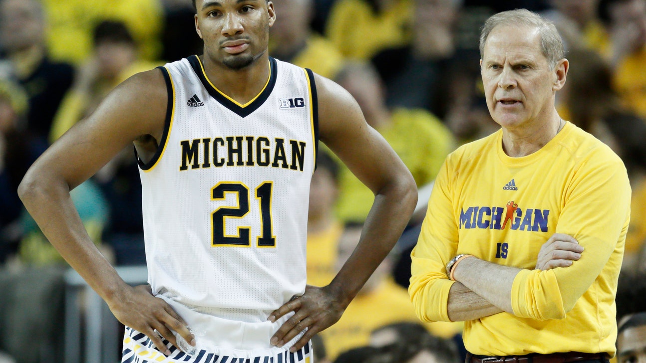 Watch Michigan's Zak Irvin save a man's face from getting destroyed