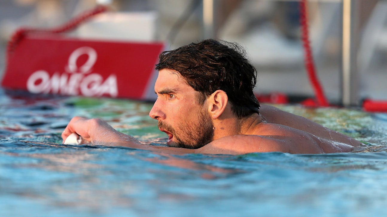 Phelps roars from last to 1st in 100 free at Arizona meet