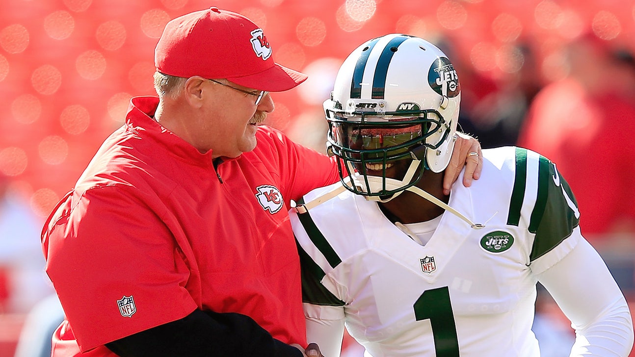 Michael Vick and Andy Reid share a moment on the sidelines