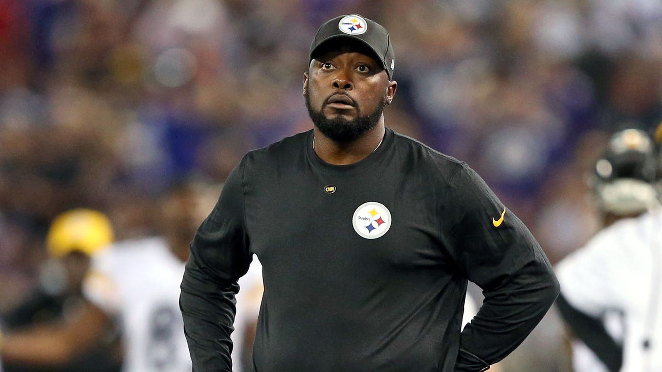 Steelers coach Tomlin helps a Ravens reporter in need