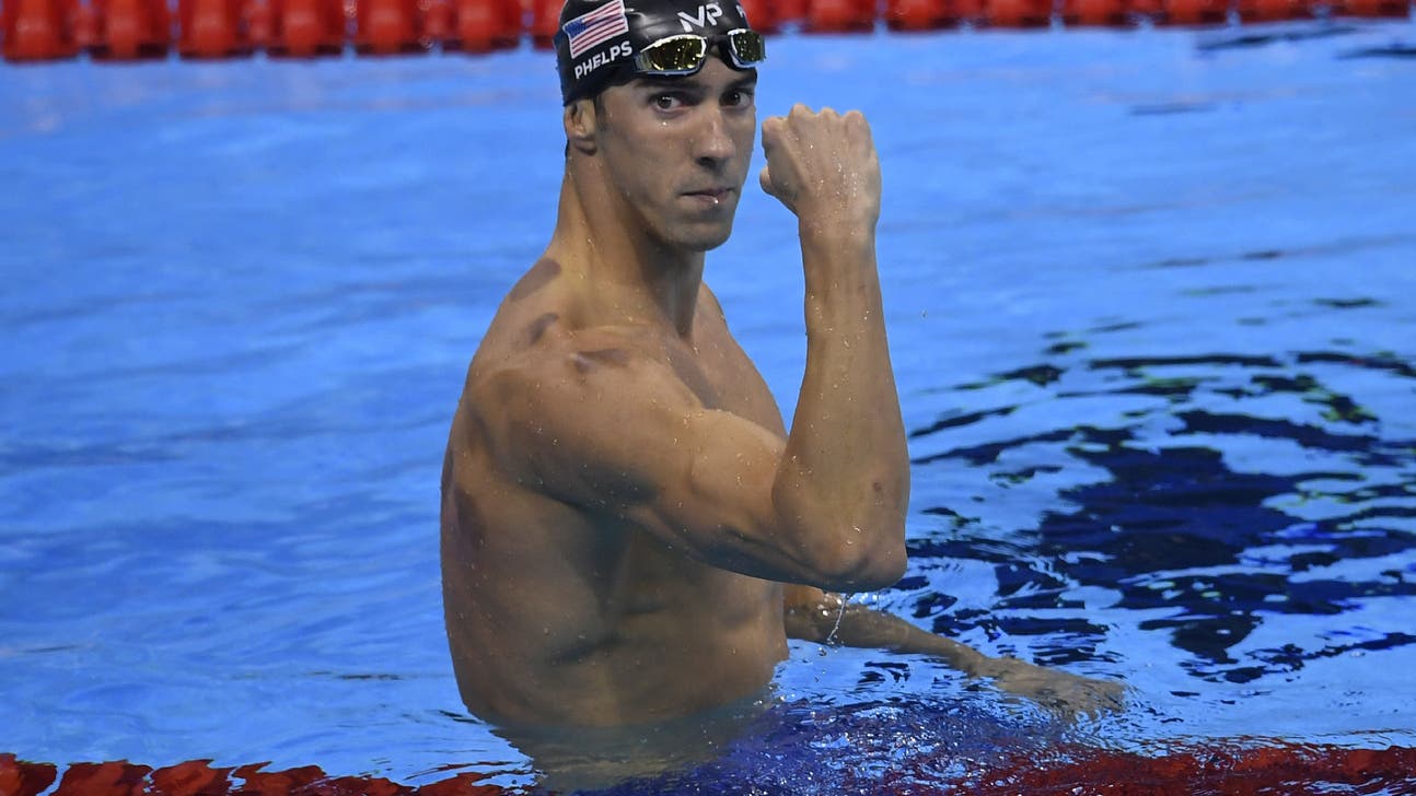 He's back! Michael Phelps regains title in 200 fly, knocks out shadowboxing Chad Le Clos