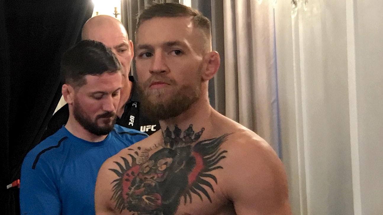 Conor McGregor, Tyron Woodley get in heated exchange following weigh-in altercation
