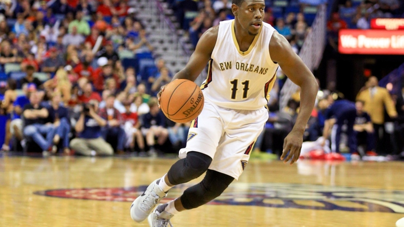 Watch Jrue Holiday throw down a monster poster dunk on Kristaps Porzingis