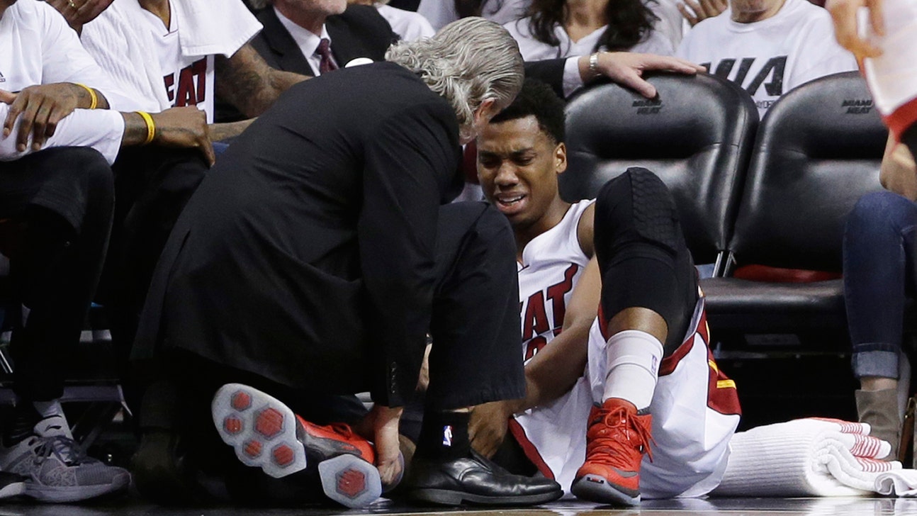 Heat center Hassan Whiteside leaves Game 3 with knee injury