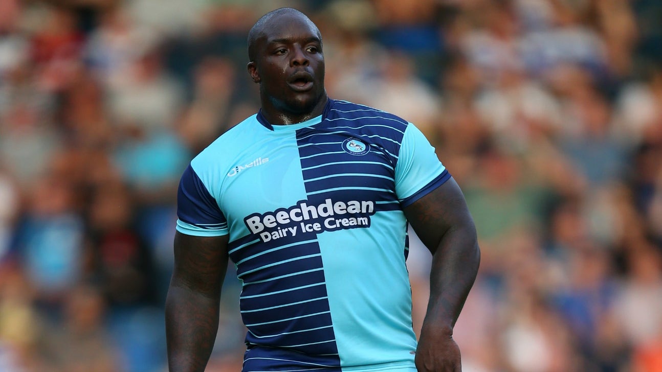 Adebayo Akinfenwa did squats with a reporter on his back for fun