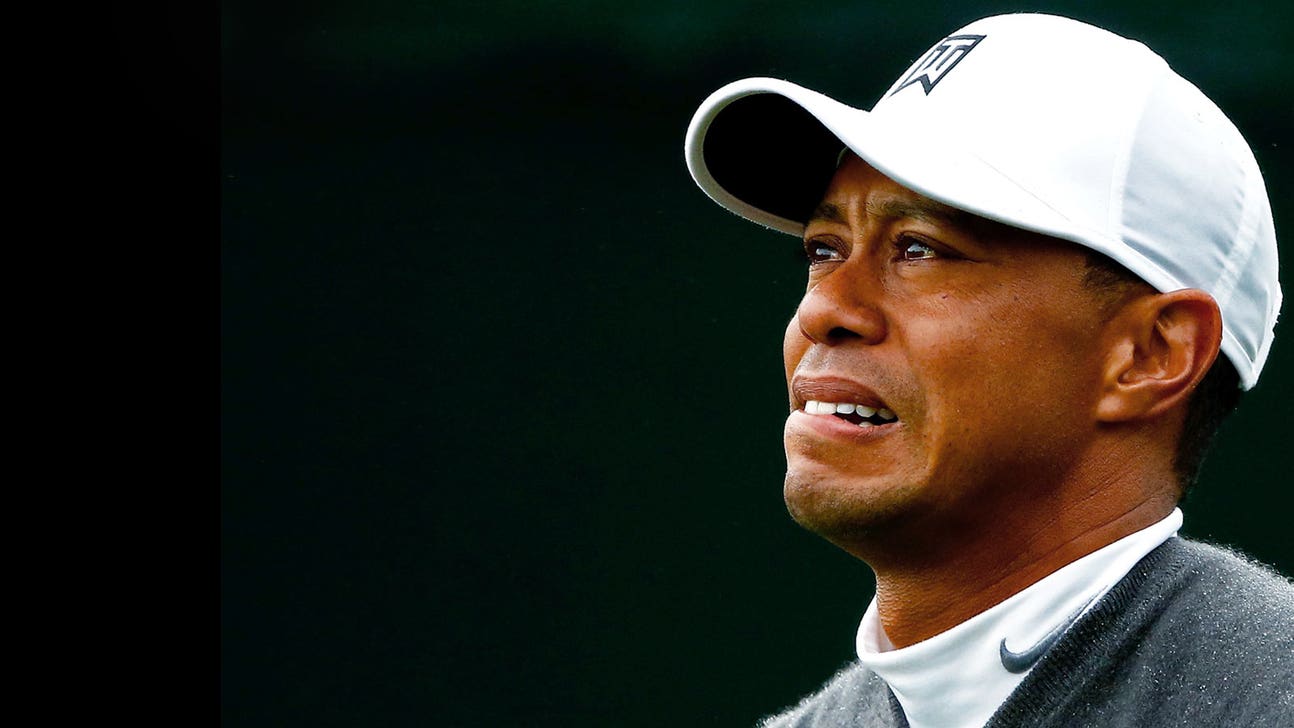 Tiger Woods withdraws because of an apparent back injury