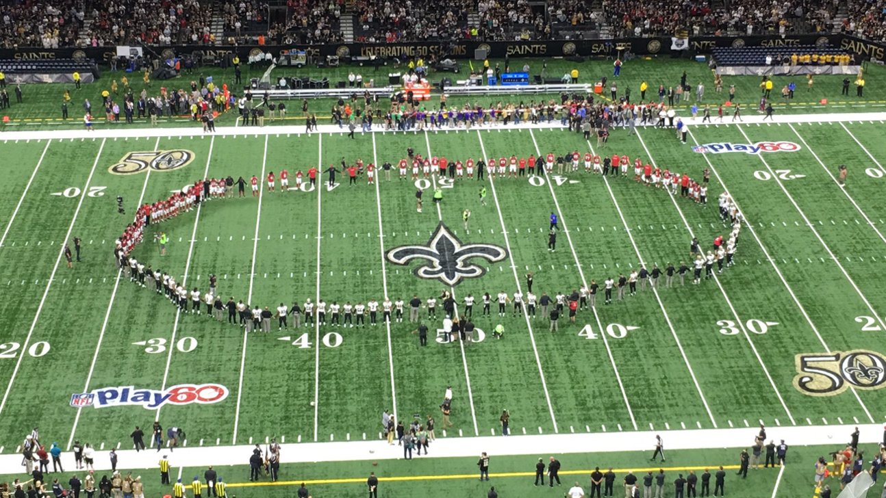 Saints, Falcons hold hands together on field after anthem in wake of police shootings