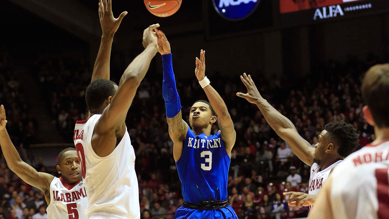 Alabama forward lifts Tyler Ulis off the ground going for a rebound