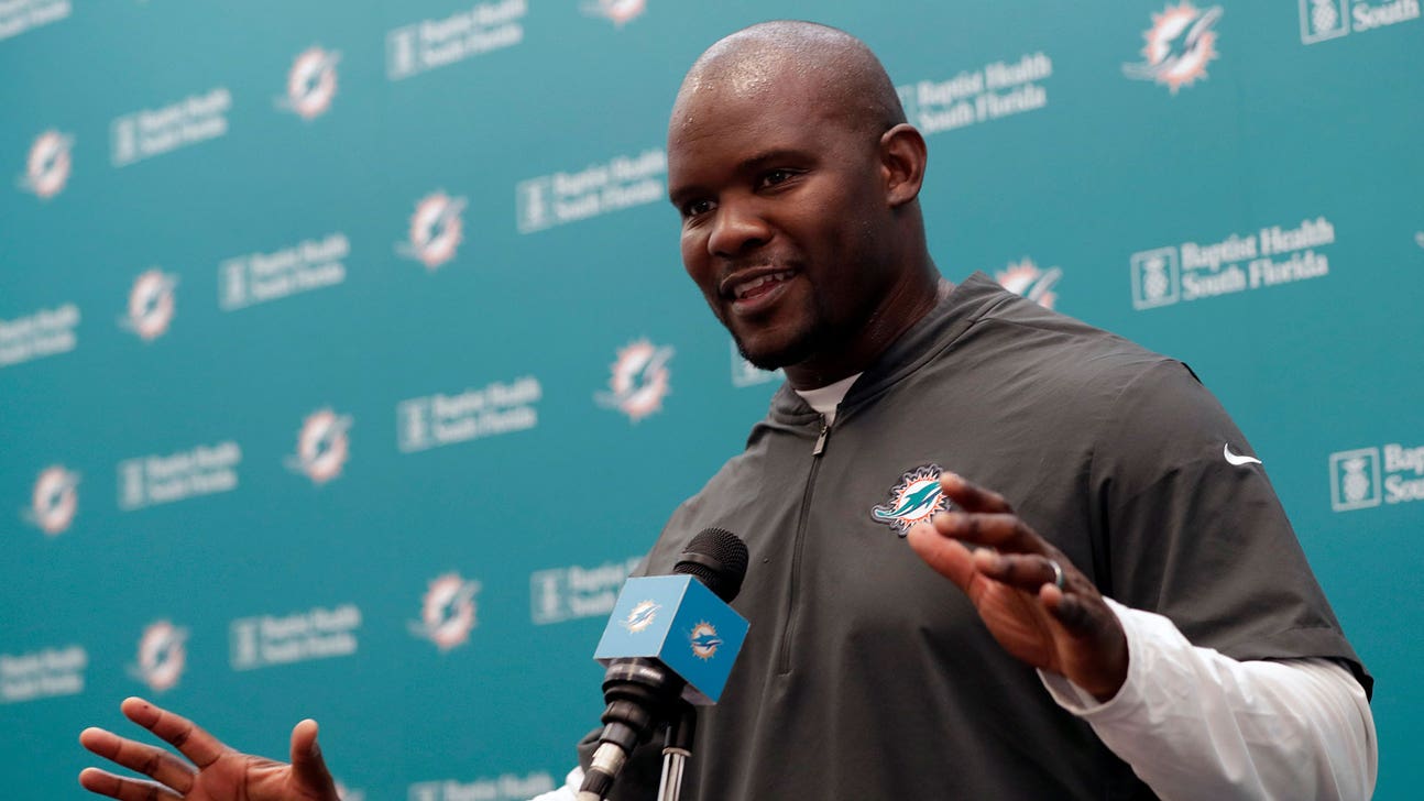 New Dolphins coach Brian Flores has his own daily workout at training camp