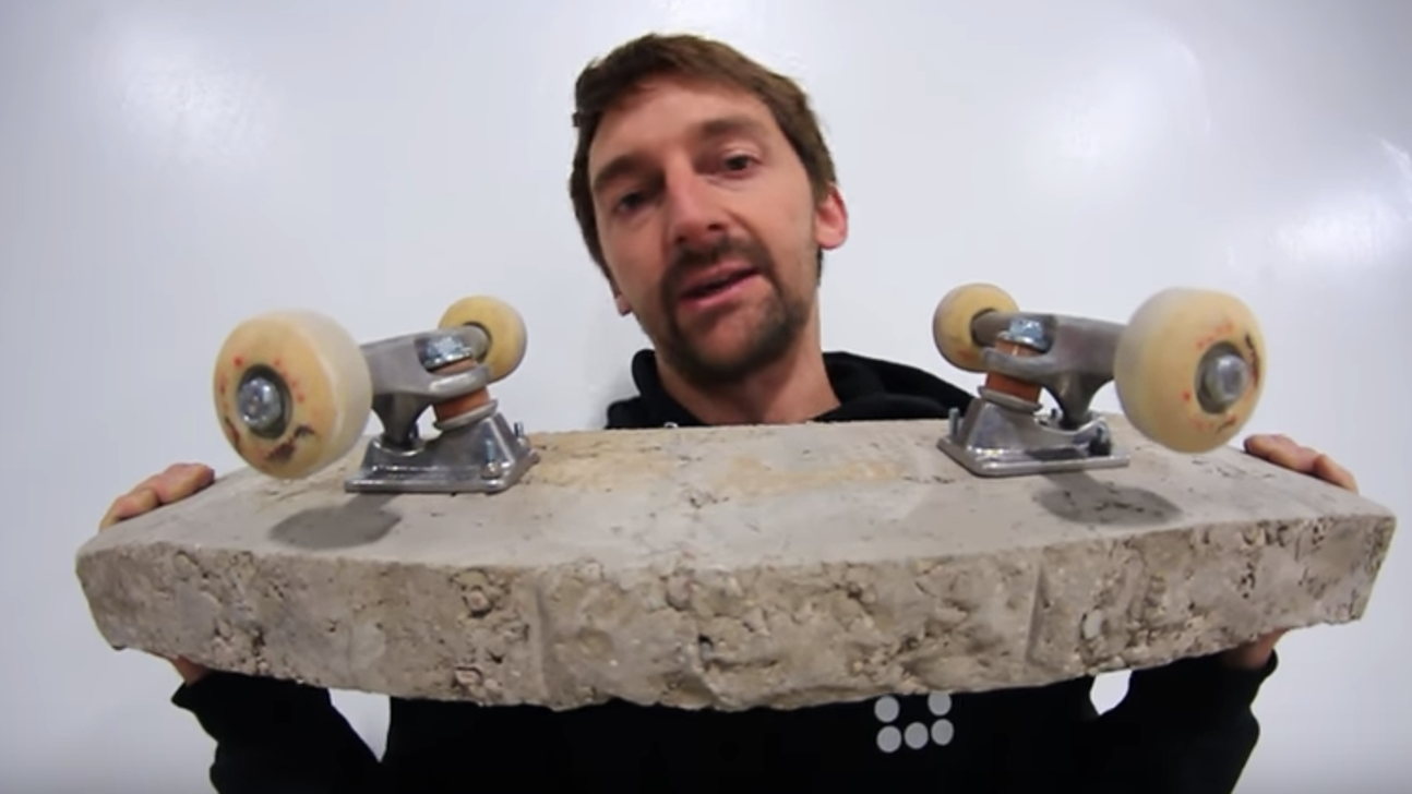 Watch a guy riding a skateboard made of solid concrete