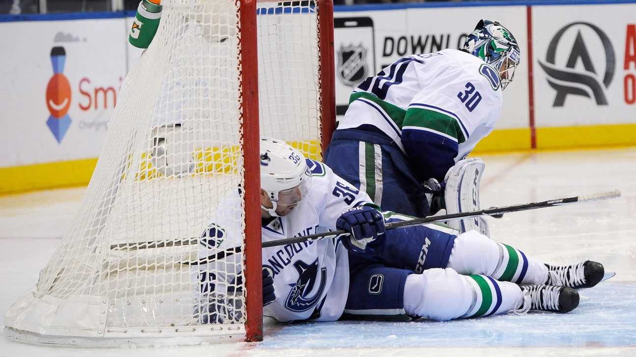 Canucks goalie Ryan Miller injured in shutout against Islanders