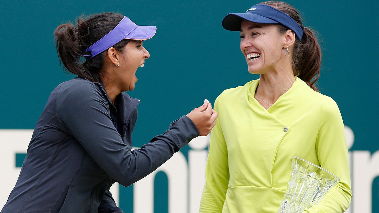 'Swiss Miss' Hingis, now 34, wins French Open doubles match