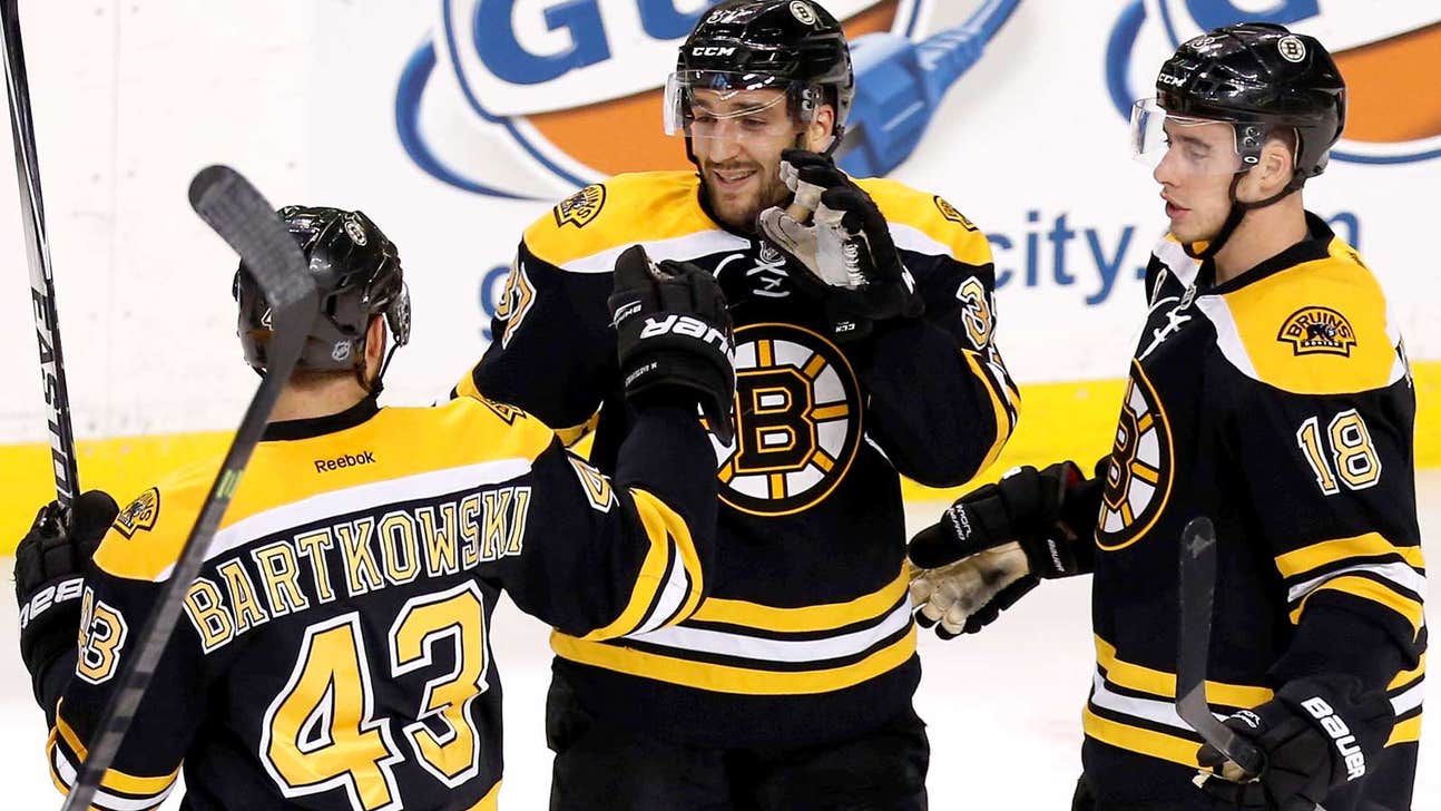 Bergeron scores twice as Rask, Bruins blank Blackhawks
