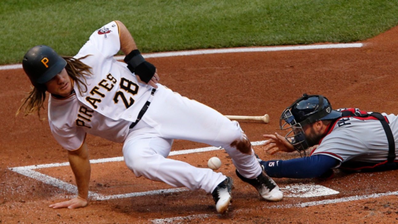 Pirates spoil Snitker's debut as manager, top Braves 12-9