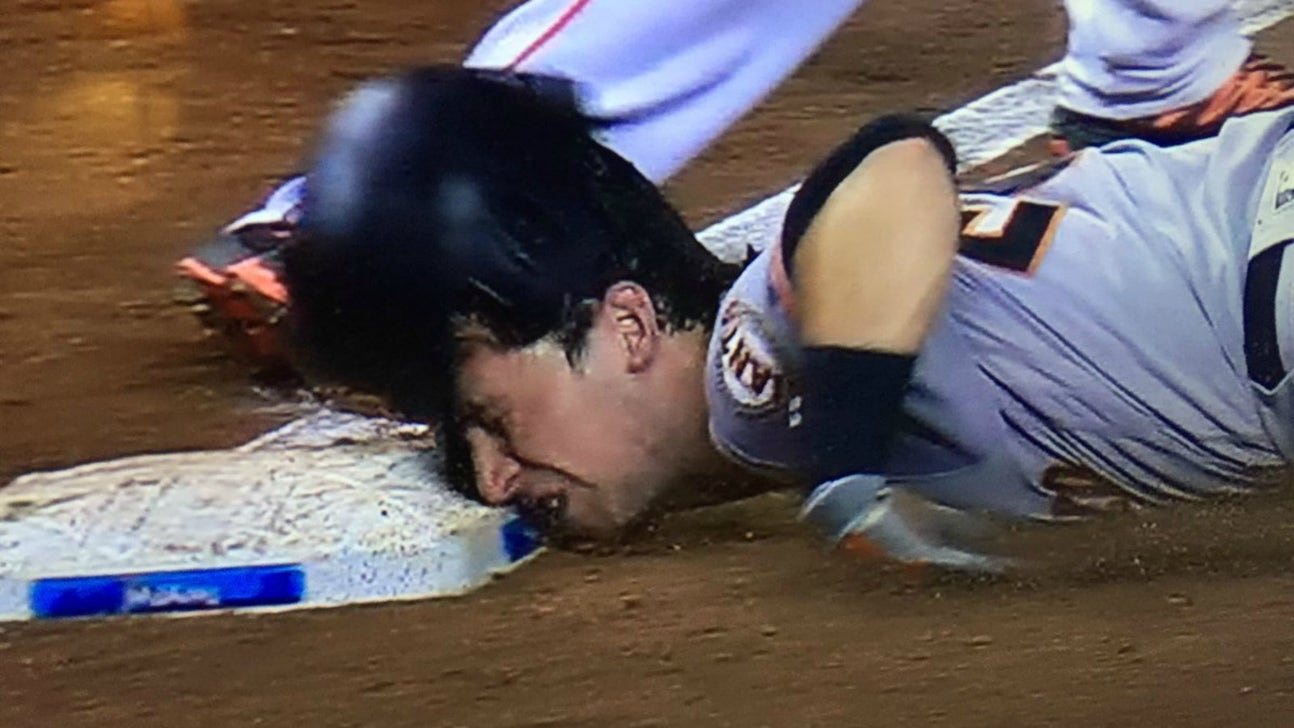 Buster Posey faceplants into third base with brutal slide