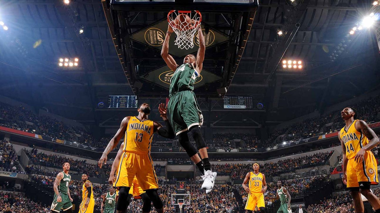 Giannis Antetokounmpo defies gravity while dunking from just inside the free throw line