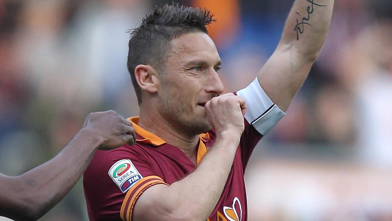Roma doubles up on Parma to keep title hopes alive