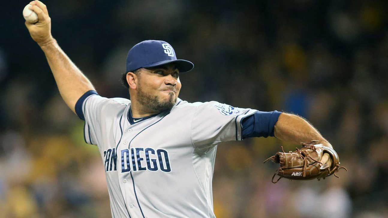 Padres pick up option on Benoit, let Barmes go