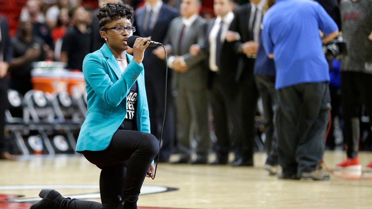 Anthem performer before Heat game kneels while singing