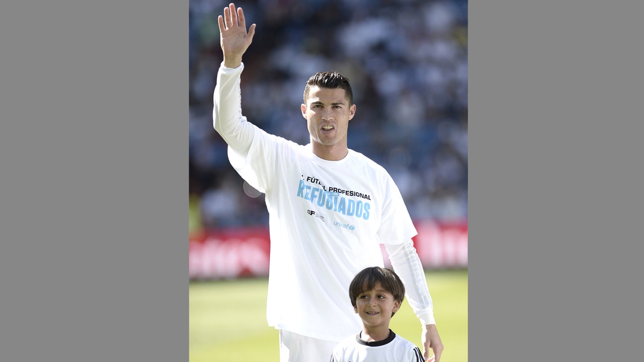 Son of tripped Syrian refugee accompanies Cristiano Ronaldo at game