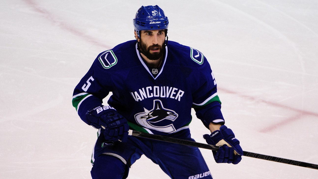 Lightning acquire defenseman Jason Garrison from Canucks
