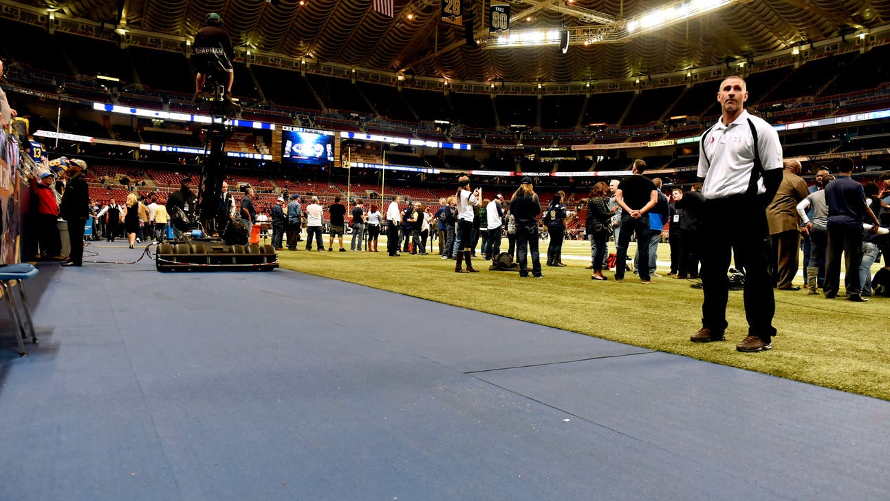 Rams cover concrete with rubberized surface at stadium