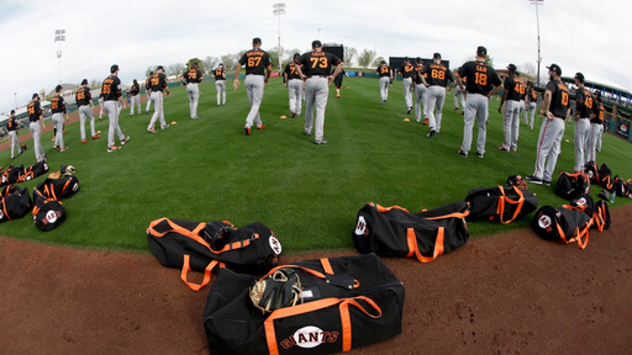 AP PHOTOS: MLB teams start spring training workouts