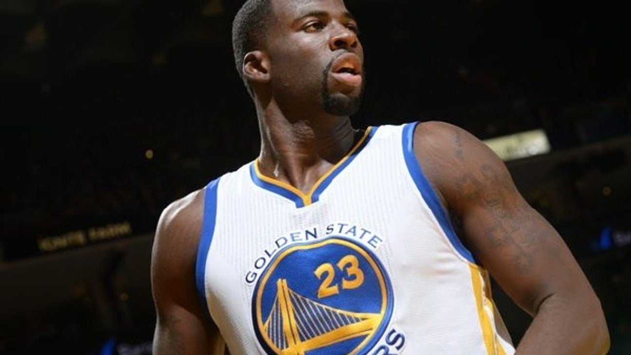 PHOTO: Draymond Green poses with championship belt