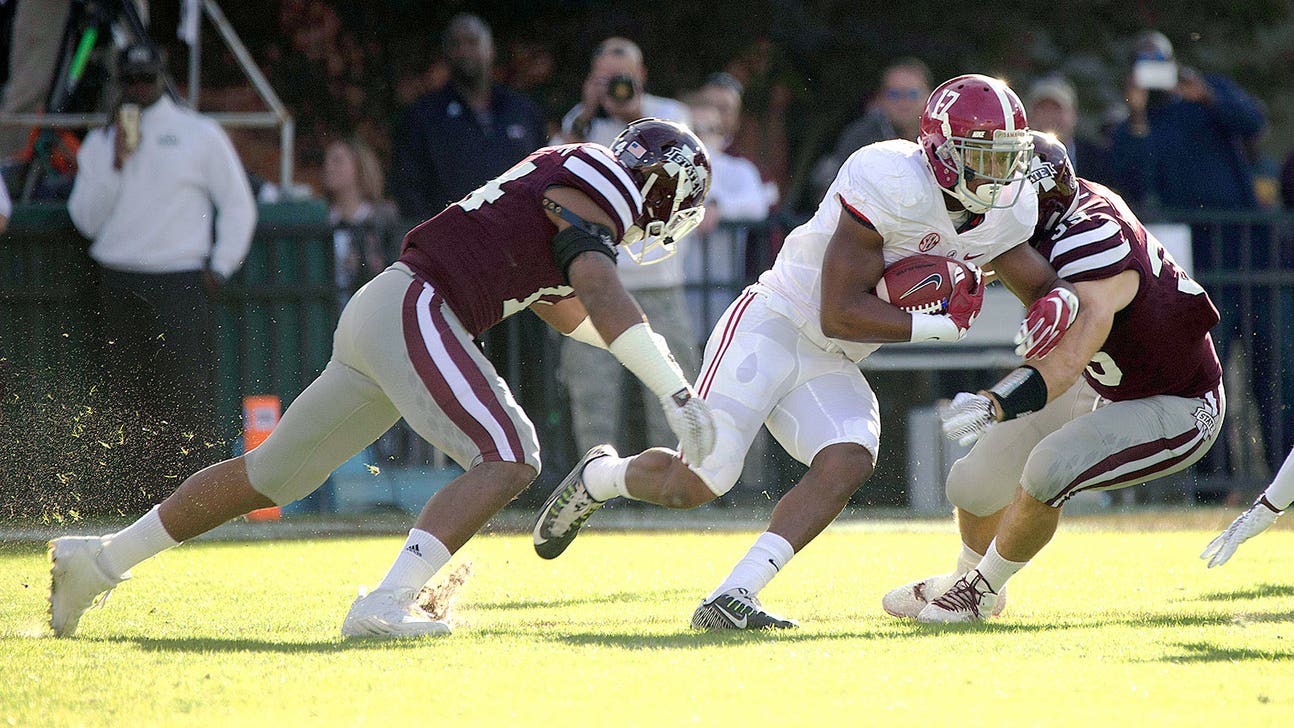 Alabama RB Drake leaves Miss. St. game after injuring right arm