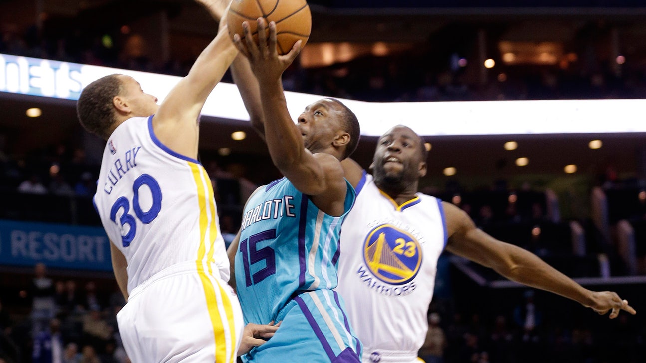 Kemba Walker conducts a magic show in front of Steph Curry