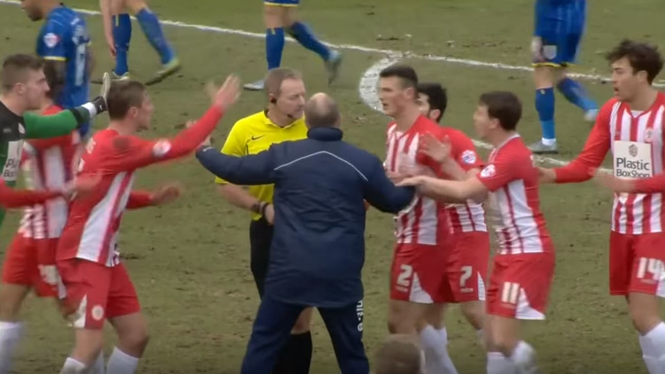 Referee whistles for halftime in the middle of an English team's goal