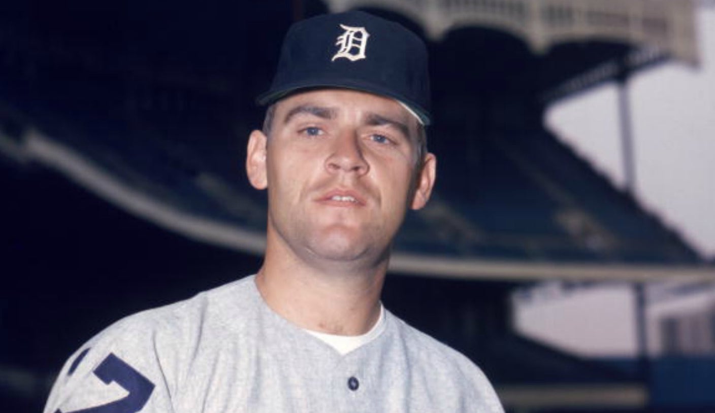 Former Detroit Tigers pitcher Denny McLain tips his hat to the