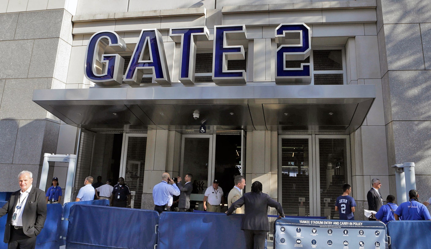 Fans go through metal detectors at Yankee Stadium