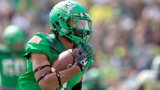 Next Story Image: Photo: Oregon WR Charles Nelson leaves practice on crutches
