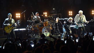 Next Story Image: Irish rock band U2 shows support for Conor McGregor before UFC 189