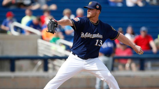 Brewers reliever Smith tears knee ligament while taking off spikes