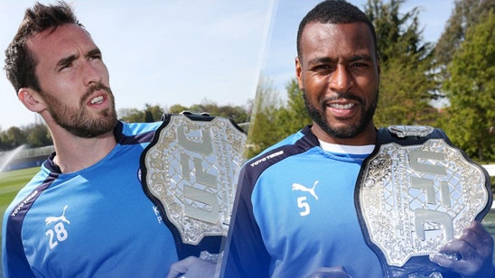 Leicester celebrate championship fight by posing with UFC title belt
