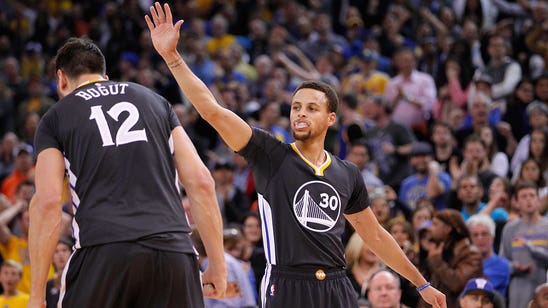 Curry scores 34, Warriors remain unbeaten with OT win over Nets