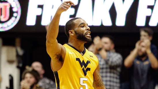 West Virginia fans storm the court, sing 'Country Roads'
