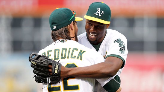 Watch: Warriors' Harrison Barnes tosses first pitch at A's game