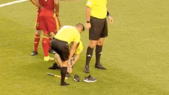 A match was stopped because the referees had to swap shoes
