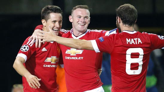 Manchester United's Rooney hits back at critics after treble