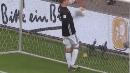 Watch Manuel Neuer somehow kick a soccer ball off his own face