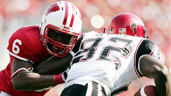 Former Wisconsin player, twin brother, charged with armed robbery